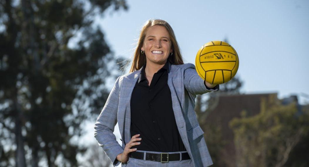 Female student holding water polo ball